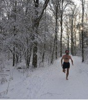Wim Hoff running in snowy forest